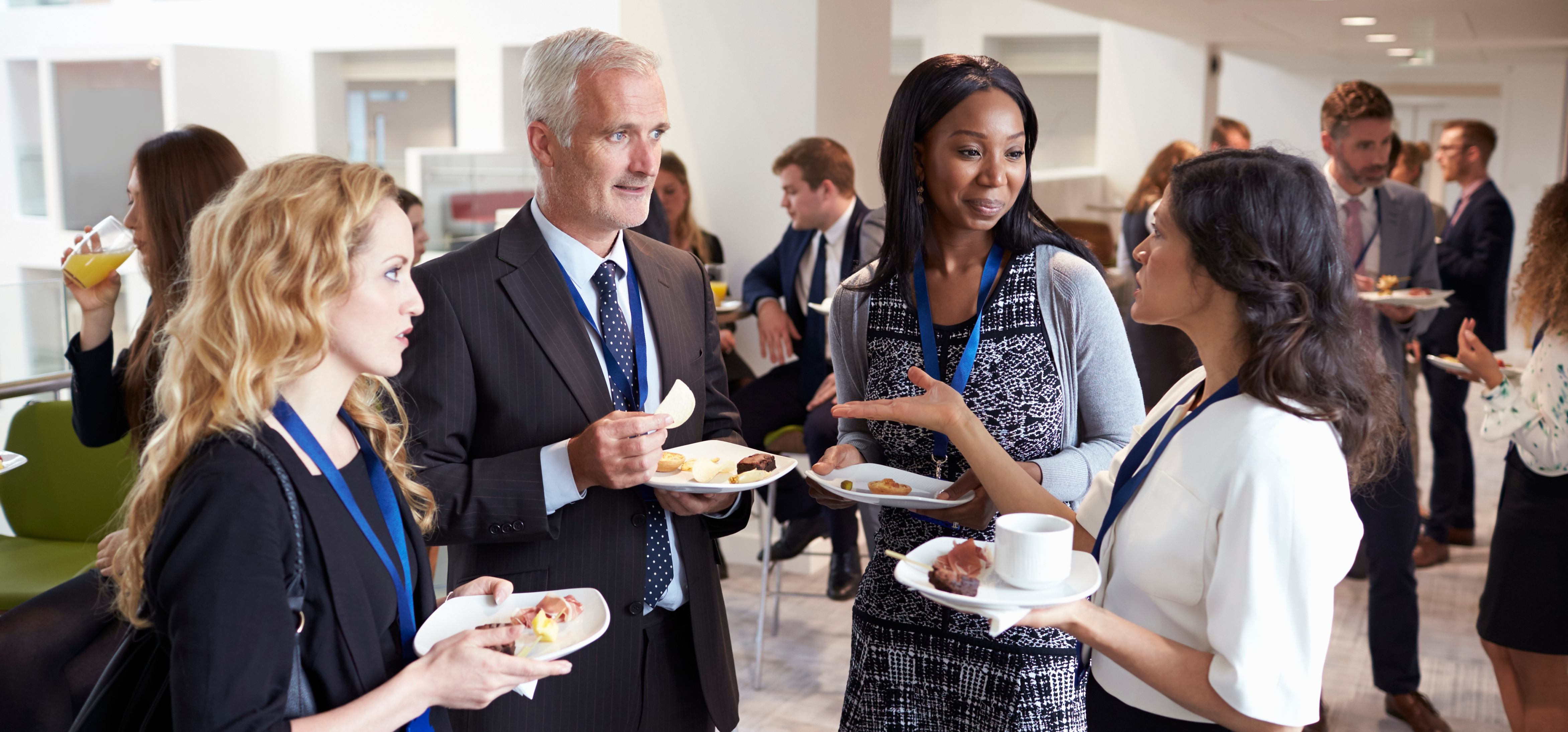 A group of people attending a business event and expressing their ideas symbolizes the activity of networking.